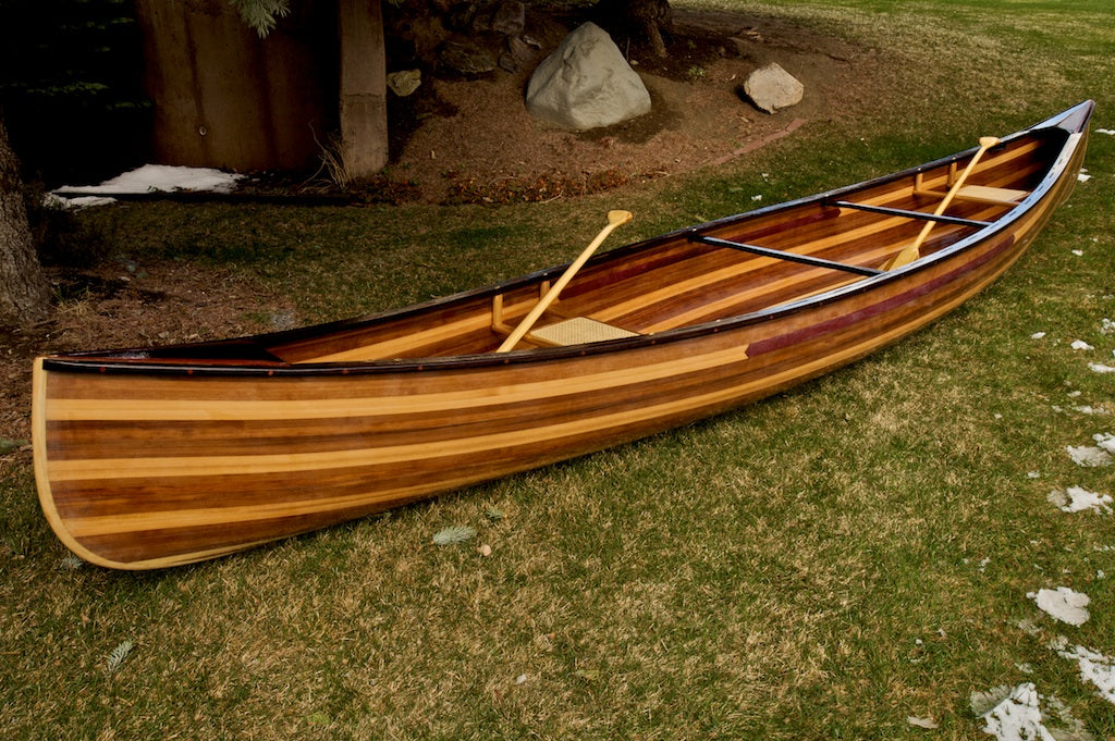 Cedar strip canoe with seats and paddles